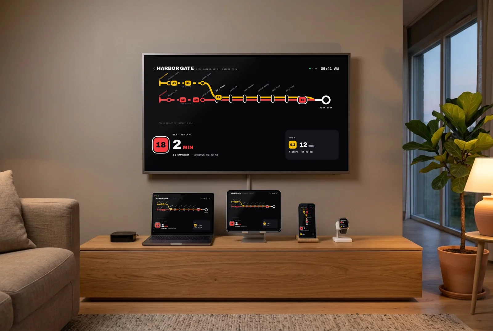 A living room with the board running on a wall-mounted TV, and on a MacBook, an iPad, an iPhone and an Apple Watch on the console below: line 18 in 2 minutes on each